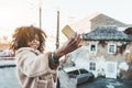 Curly-hair girl is taking a selfie